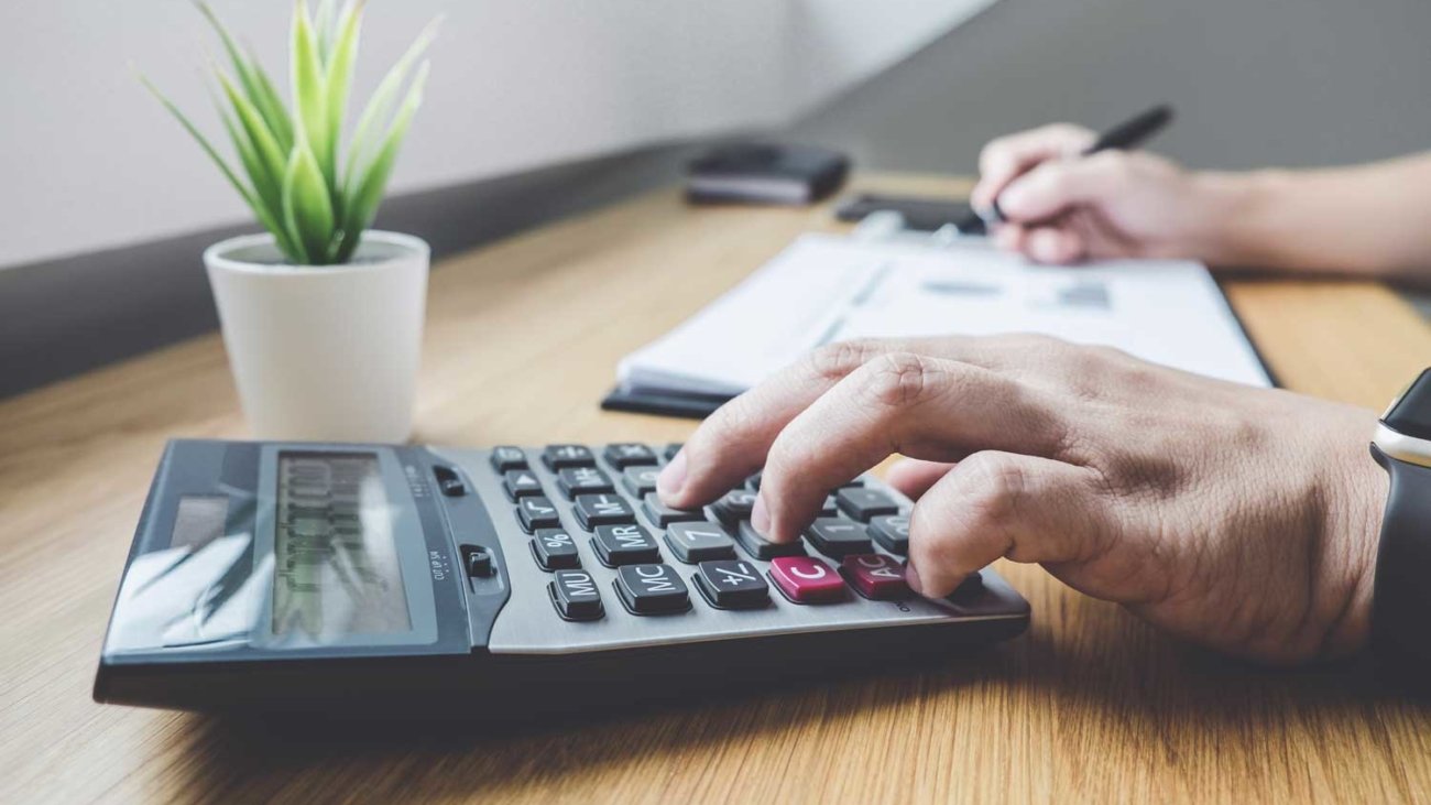 businessman-working-on-a-graph-document-financial--PHKF55L